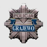 Logo Policji - szara gwiazda na jasnym  tle z napisem Grajewo na niebieskim tle